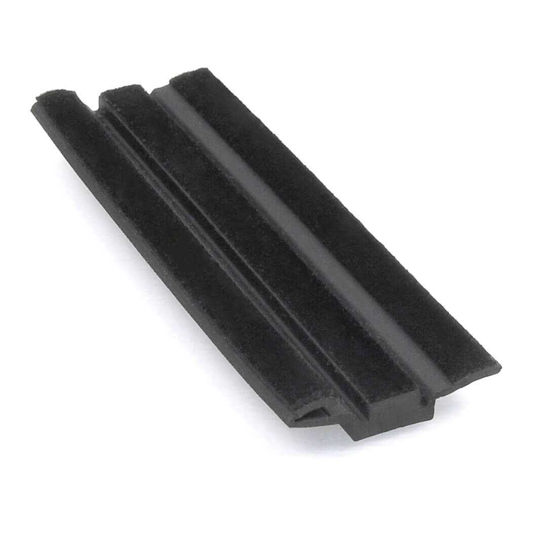 An extruded weatherstrip seal with flocking, used in automotive glazing for glass run channels.