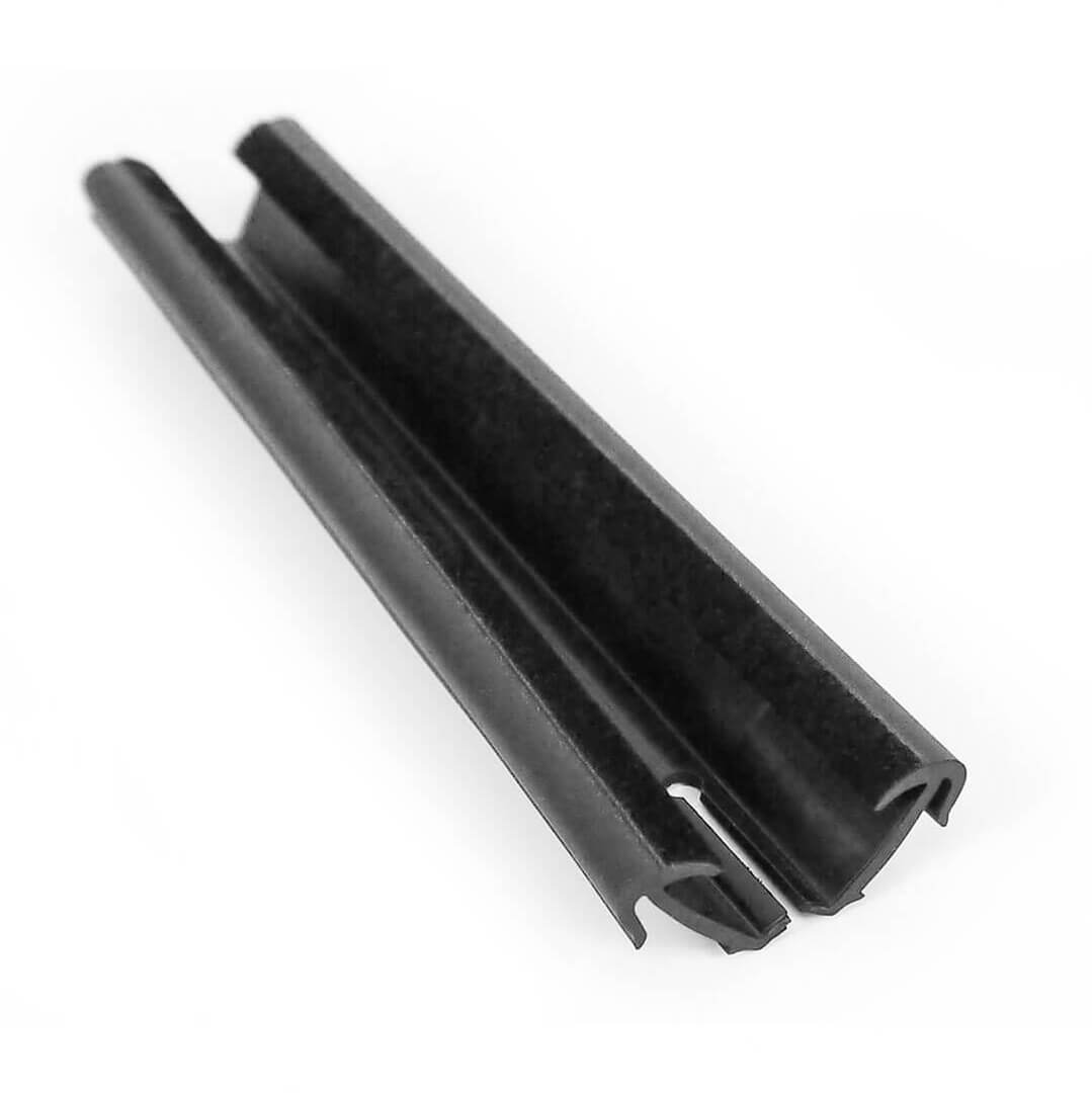 An extruded seal with flocking and fabricated cutouts, used in automotive glazing.