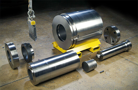 A picture of a typical set of support tooling and press tooling for aluminum extrusion.