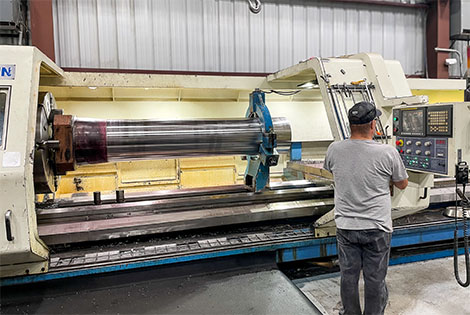 The stem of an aluminum extrusion press being milled.